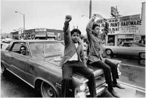 chicanos from the 70s on a car